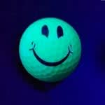 BLACK LIGHT SMILEY FACE GOLF BALL